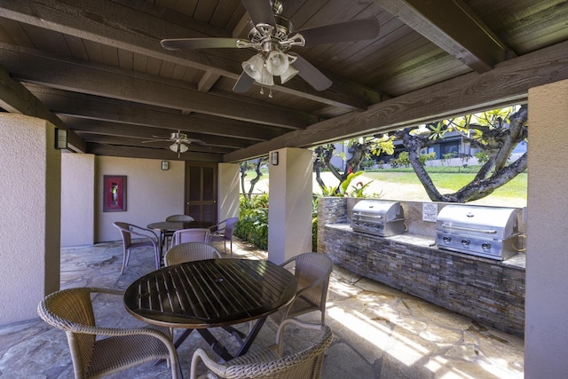 view of patio / terrace with area for grilling, exterior kitchen, and ceiling fan