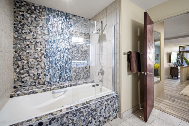 bathroom with tile patterned flooring and tiled shower / bath combo