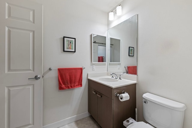 bathroom with toilet and vanity