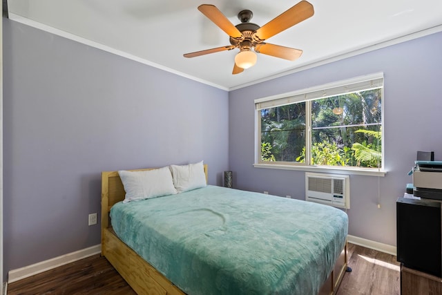 bedroom with dark hardwood / wood-style flooring, an AC wall unit, ceiling fan, and crown molding