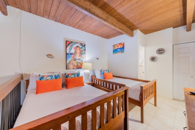 bedroom with wood ceiling, beamed ceiling, and light tile patterned floors