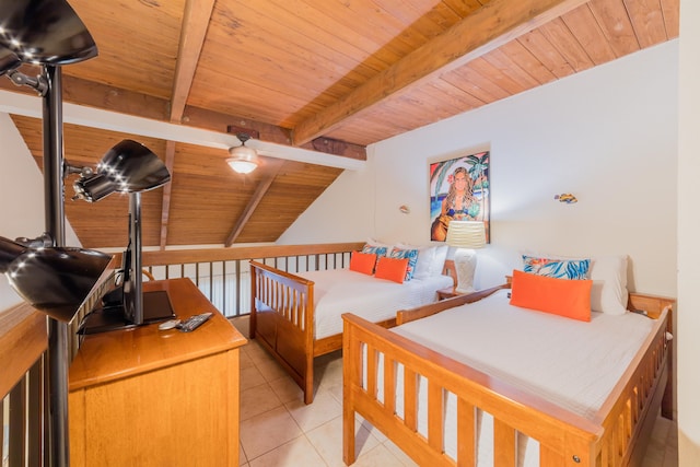 bedroom with beamed ceiling, light tile patterned floors, and wooden ceiling