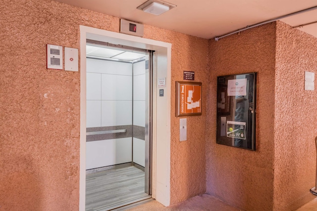 doorway to property featuring elevator