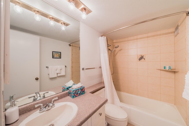 full bathroom with toilet, shower / bathtub combination with curtain, and vanity