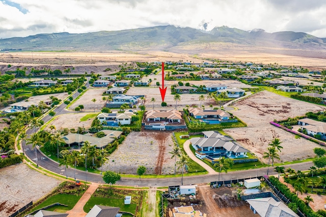 birds eye view of property featuring a mountain view