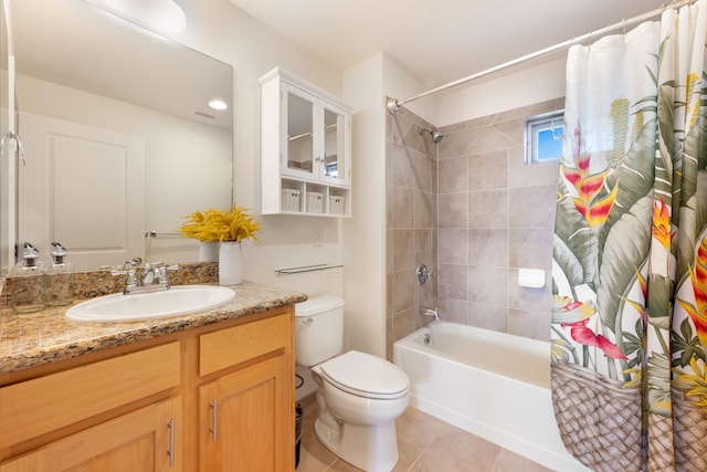 full bathroom featuring vanity, tile patterned flooring, shower / bathtub combination with curtain, and toilet