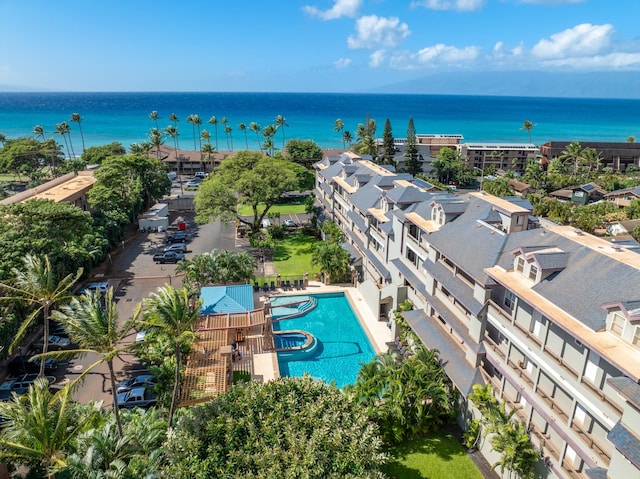 birds eye view of property with a water view