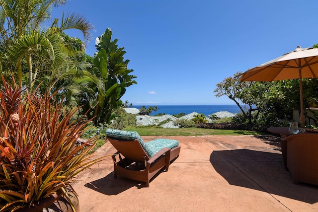 view of patio with a water view