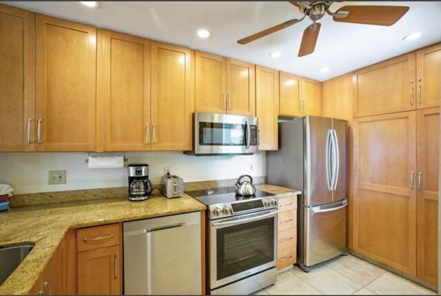 500 Kapalua Dr Unit 16T1, Lahaina, HI 96761 - kitchen featuring appliances with stainless steel finishes, ceiling fan, light tile patterned floors, light stone countertops, and recessed lighting