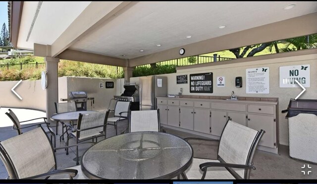 500 Kapalua Dr Unit 16T1, Lahaina, HI 96761 - view of patio / terrace featuring outdoor dining area, a sink, and area for grilling