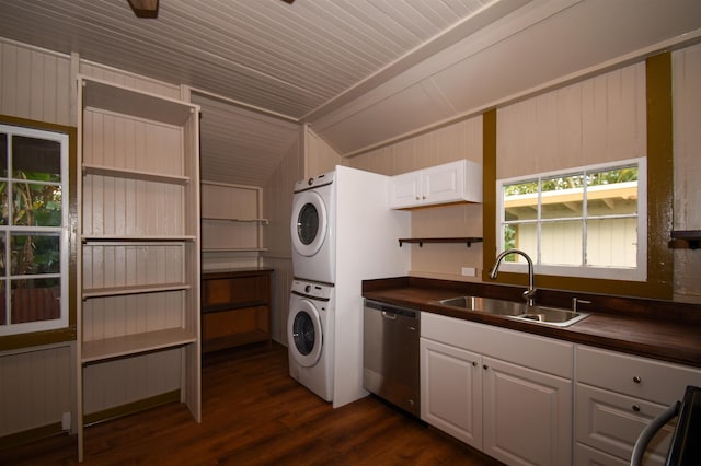 laundry room with dark hardwood / wood-style floors, stacked washing maching and dryer, sink, and wood walls