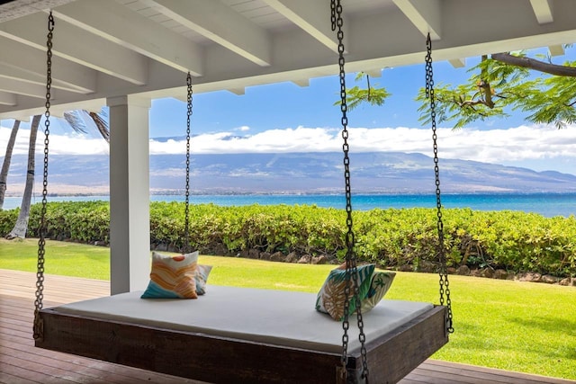 deck featuring a yard and a water and mountain view