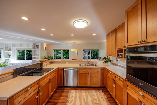 1220 W Kuiaha Rd, Haiku, HI 96708 - kitchen featuring stainless steel appliances, recessed lighting, dark wood-style floors, brown cabinetry, and light countertops