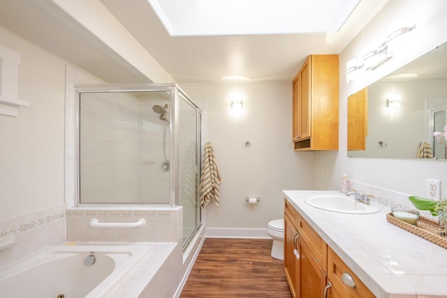 1220 W Kuiaha Rd, Haiku, HI 96708 - bathroom with vanity, a whirlpool tub, a shower stall, and wood finished floors