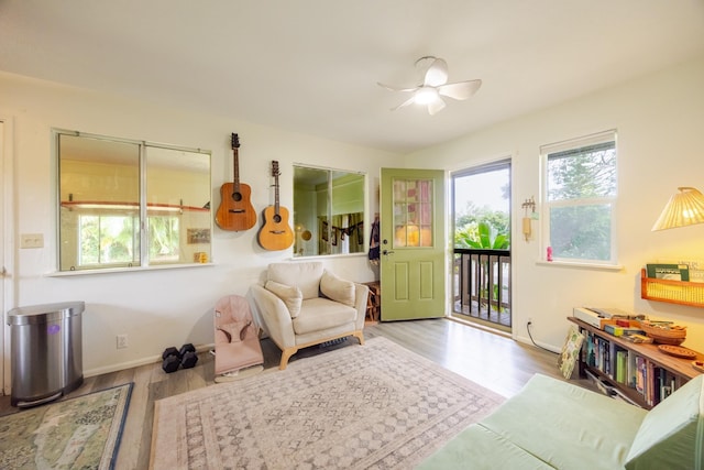 1220 W Kuiaha Rd, Haiku, HI 96708 - sitting room with healthy amount of natural light, wood finished floors, and a ceiling fan