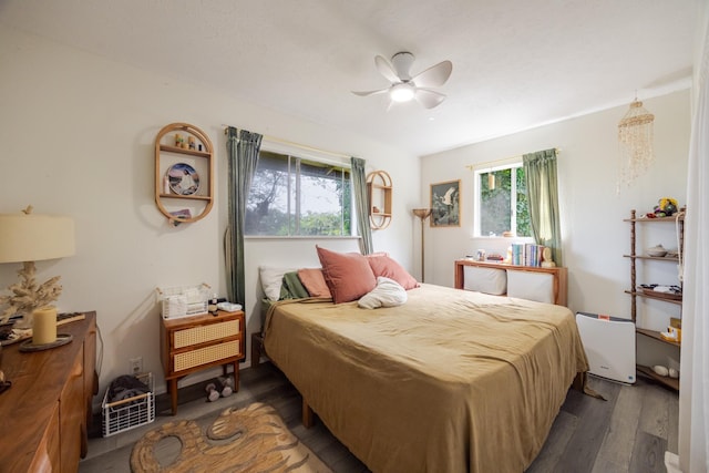 1220 W Kuiaha Rd, Haiku, HI 96708 - bedroom featuring dark wood-style flooring and a ceiling fan