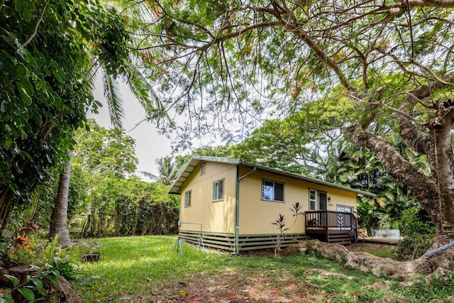 1220 W Kuiaha Rd, Haiku, HI 96708 - view of property exterior featuring a wooden deck and a lawn