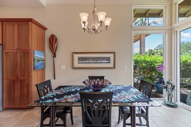 dining space featuring an inviting chandelier