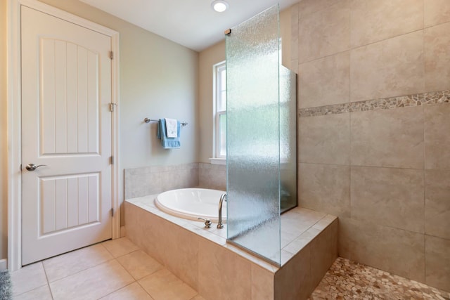 bathroom featuring separate shower and tub and tile patterned flooring