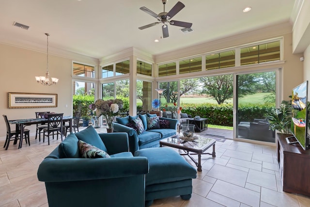 tiled living room featuring ceiling fan with notable chandelier and ornamental molding