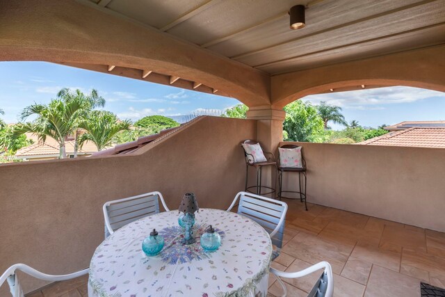 view of patio with a balcony