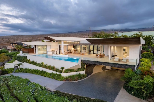 14 Halapa Pl, Kihei, HI 96753 - view of swimming pool featuring an outdoor hangout area, an infinity pool, a patio, exterior kitchen, and french doors