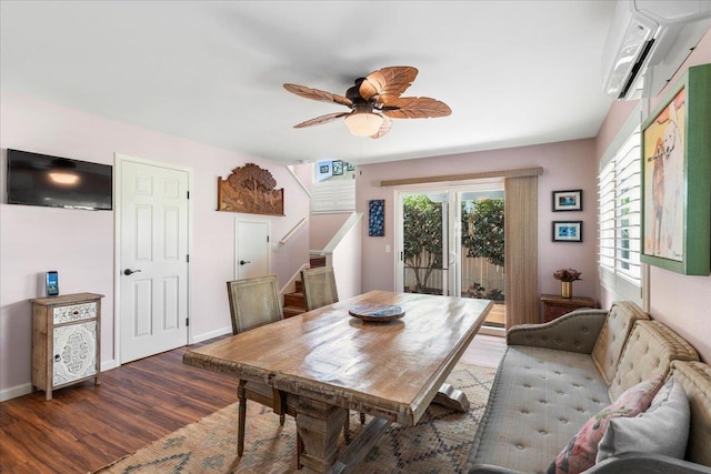 dining space featuring dark hardwood / wood-style floors, ceiling fan, and an AC wall unit