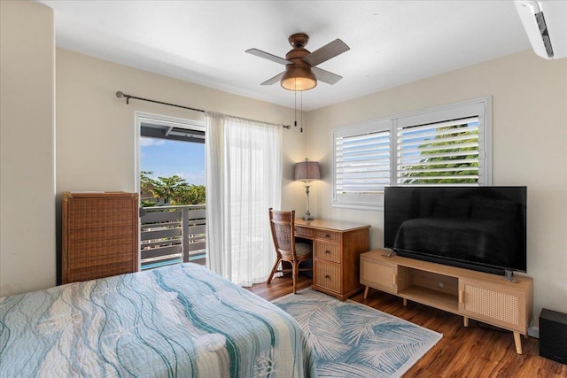 bedroom with dark hardwood / wood-style flooring, multiple windows, and ceiling fan