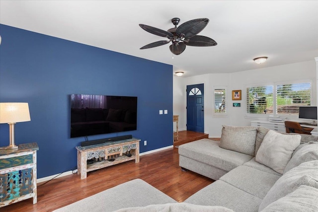 living room featuring hardwood / wood-style flooring and ceiling fan