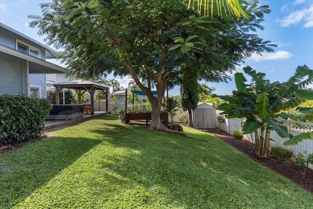 view of yard with a gazebo and a shed