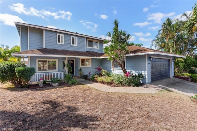 view of front of home featuring a porch and a garage