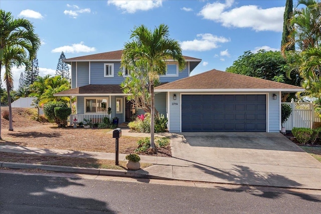 view of front of property featuring a porch and a garage