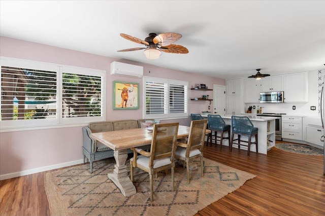 dining space with dark hardwood / wood-style floors, an AC wall unit, and ceiling fan