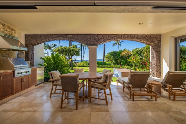 view of patio with grilling area and an outdoor kitchen