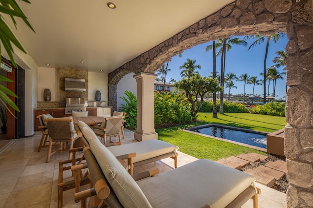 view of patio with a grill and exterior kitchen