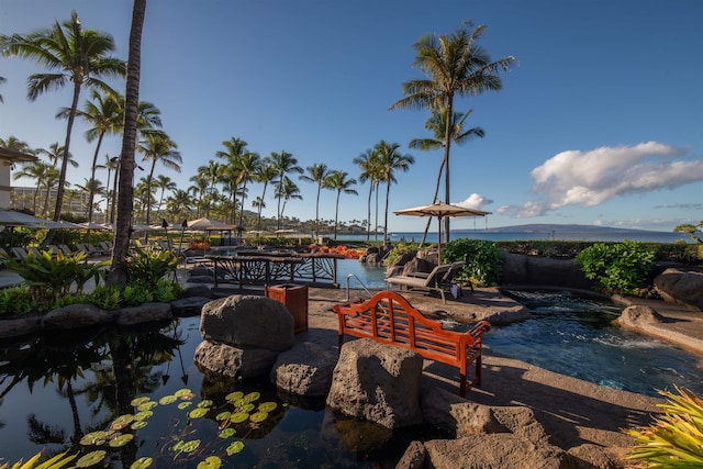 view of patio featuring a water view