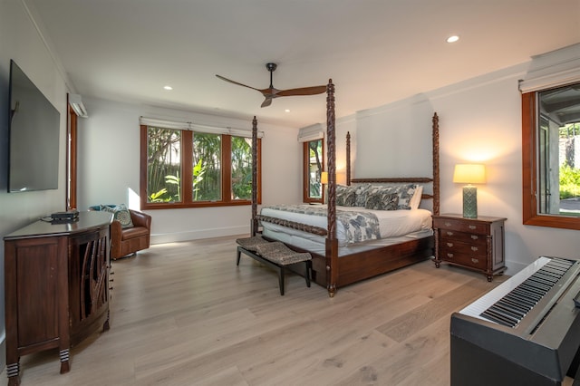 bedroom with ceiling fan, light hardwood / wood-style flooring, and crown molding