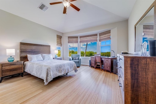 bedroom with light wood-type flooring, ceiling fan, and vaulted ceiling