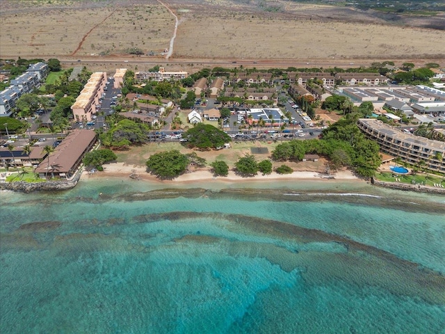 bird's eye view featuring a view of the beach and a water view