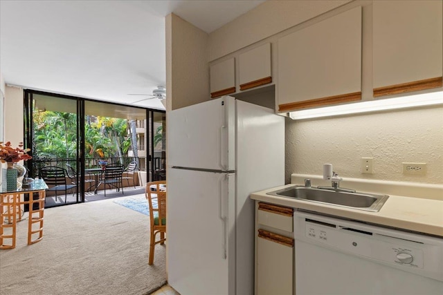 3615 Lower Honoapiilani Rd Unit 317, Lahaina, HI 96761 - kitchen featuring white appliances, a ceiling fan, light carpet, light countertops, and expansive windows