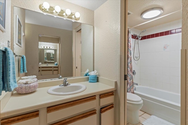 full bathroom with vanity, toilet, shower / bath combo with shower curtain, and tile patterned flooring