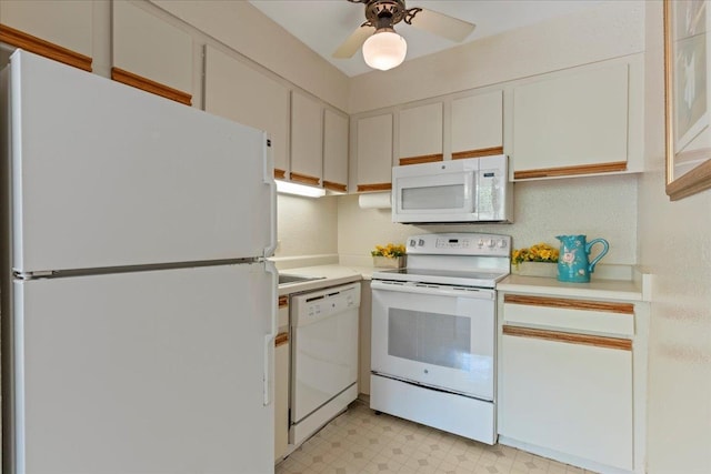 kitchen featuring white appliances, ceiling fan, and white cabinetry