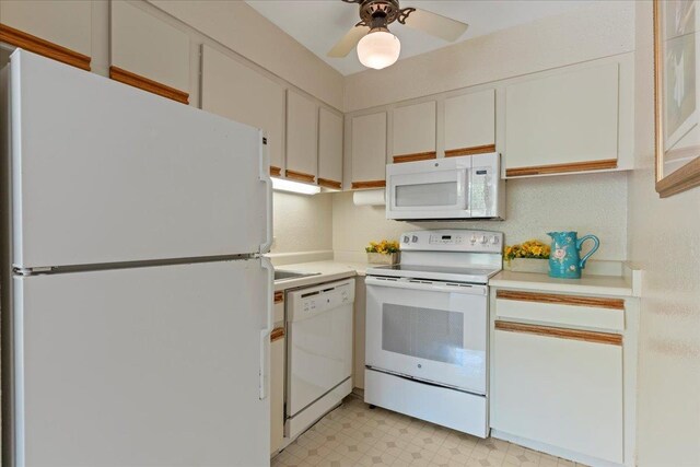 3615 Lower Honoapiilani Rd Unit 317, Lahaina, HI 96761 - kitchen with white appliances, light countertops, light flooring, and a ceiling fan