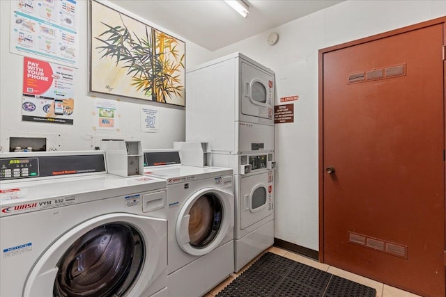 washroom with washer and dryer, light tile patterned flooring, and stacked washing maching and dryer