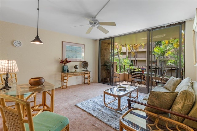 living room featuring ceiling fan and carpet floors