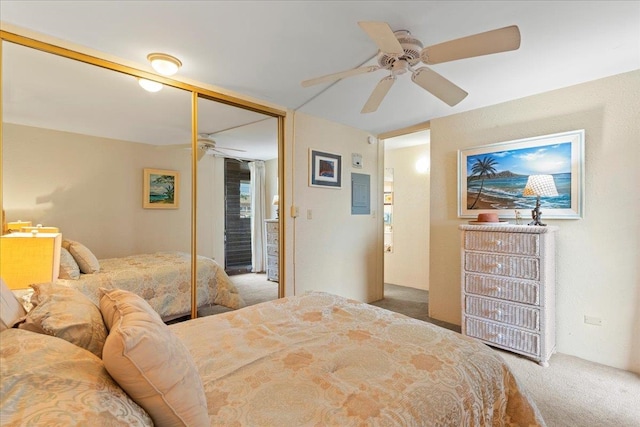 carpeted bedroom with a closet and ceiling fan