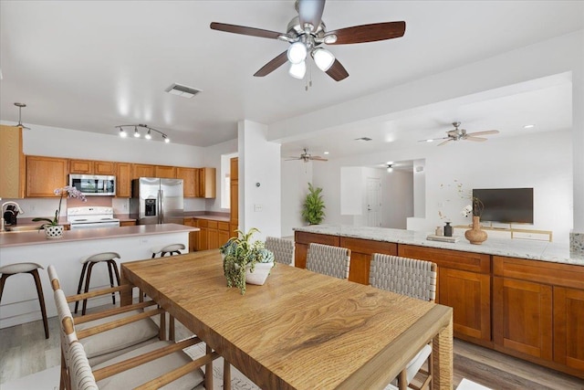 dining room with light wood-type flooring