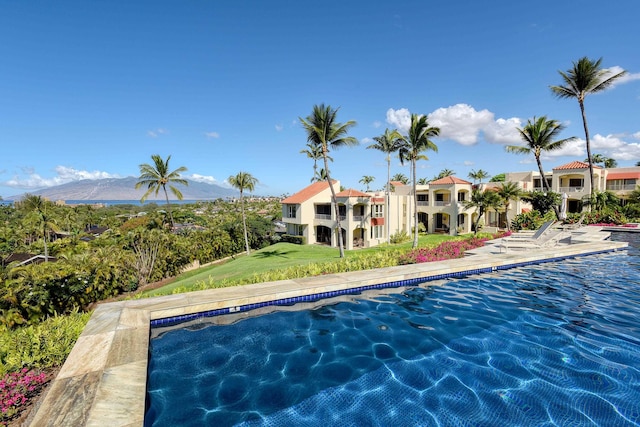 3150 Wailea Alanui Dr Unit 3807, Kihei, HI 96753 - outdoor pool with a lawn and a mountain view