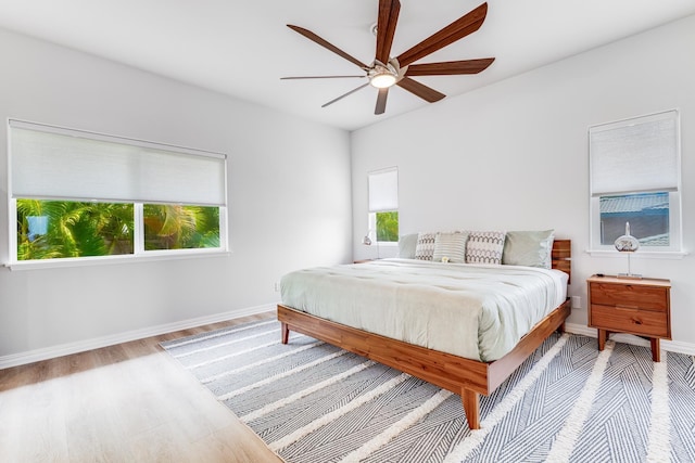 9 Fern Pl, Lahaina, HI 96761 - bedroom with baseboards, ceiling fan, multiple windows, and wood finished floors
