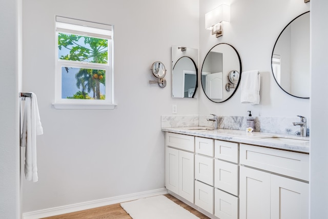 9 Fern Pl, Lahaina, HI 96761 - full bath featuring double vanity, a sink, baseboards, and wood finished floors